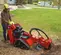 Red and black TORO Stump Grinder, 20-30 HP, Gas Powered